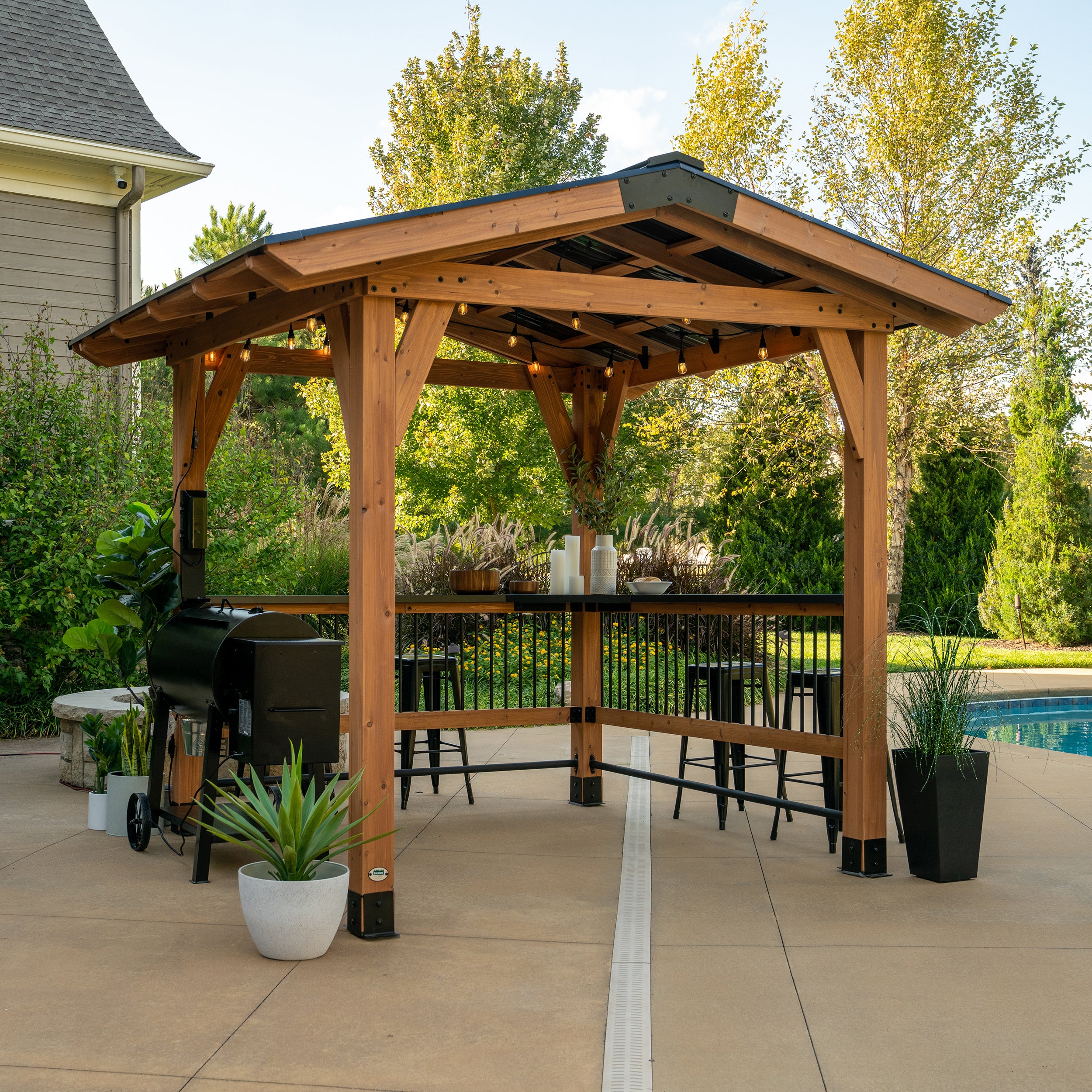 Granada Grill Gazebo on patio by pool